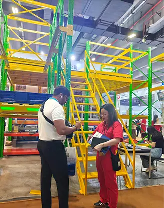 Trade visitors reviewing electrostatic powder-coated upright frames