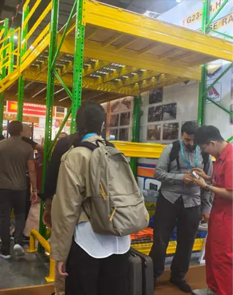 Overseas logistics managers reviewing pallet rack load calculations